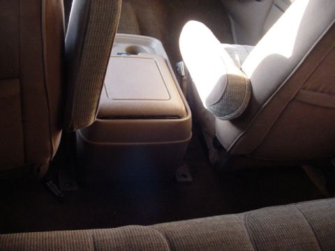 1989 Ford Bronco - The interior of a 1989 Ford Bronco, showing the center console and front seats.