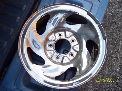 1993 Ford Bronco - Chrome alloy wheel with Ford logo, likely from a truck or SUV.