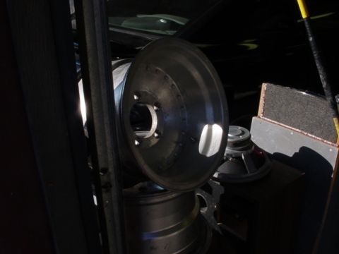 1989 Ford Bronco - A car wheel and a speaker are visible in this image.