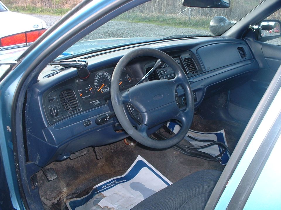 1999 Ford Crown Victoria interior with blue dashboard and steering wheel
