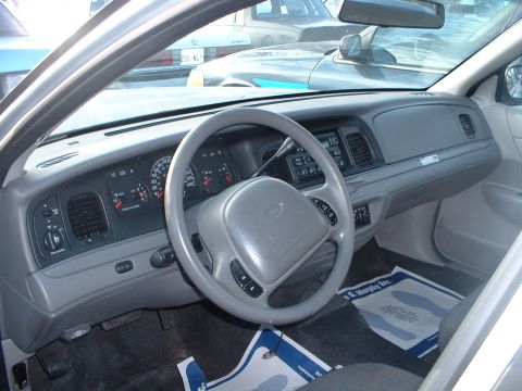 1999 Ford Crown Victoria - Interior view of a 1999 Ford Crown Victoria, its dashboard and steering wheel.