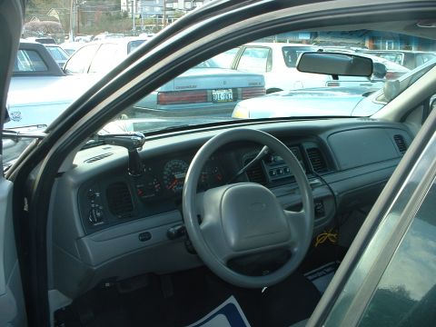 1999 Ford Crown Victoria - Interior view of a 1998 Ford Crown Victoria, with other vehicles visible through the windows.