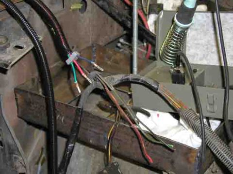 1988 Ford Bronco - A close-up view of a vehicle's wiring harness, showing various colored wires and connectors.