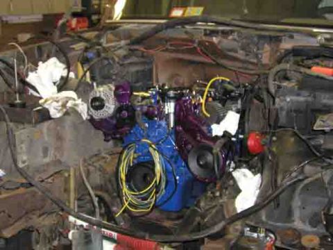1988 Ford Bronco - Engine bay components during a repair or installation process, showing various parts and wiring.