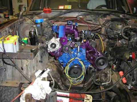 1988 Ford Bronco - The engine bay shows a custom painted engine with various components and wiring.