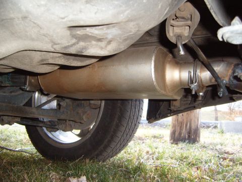 1993 Ford Probe - Undercarriage view showing the exhaust system and a tire. The registry claims this is a 1993 Ford Probe, but the image does not provide eno…