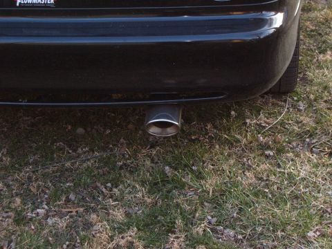 1993 Ford Probe - Close-up of a car's rear bumper and exhaust pipe, with 'FLOWMASTER' branding visible.