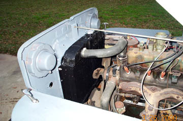 1954 Jeep Wrangler - Front view of a 1949 Jeep CJ-3A engine bay, focusing on the radiator and engine components.