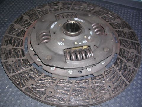 2003 Chevrolet Monte Carlo - A close-up view of a vehicle clutch disc, showing its internal springs and friction material.