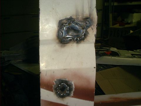 1990 Ford Bronco - crappy plug welded holes from lock and handle. these will get bondo to finish them off.