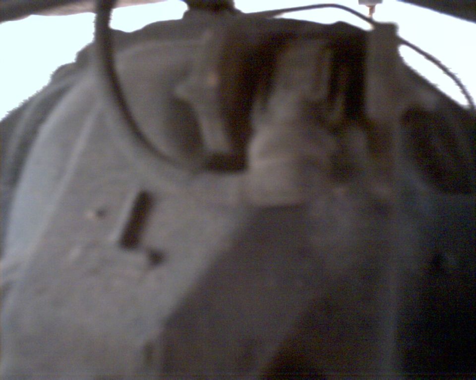 Close-up of a vehicle's undercarriage part, possibly a differential housing
