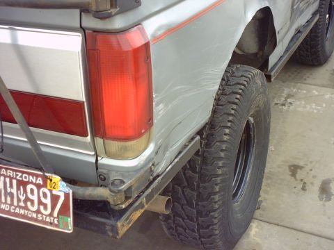 1990 Ford Bronco - Rear view of a 1990 Ford Bronco showing the taillight and license plate.