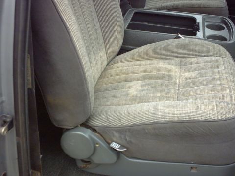 1990 Ford Bronco - Interior view of a car seat and center console.