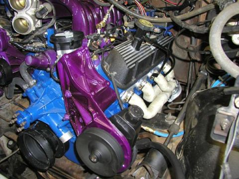 1988 Ford Bronco - Custom painted engine components in purple and blue, with white-wrapped exhaust pipes visible in the engine bay.