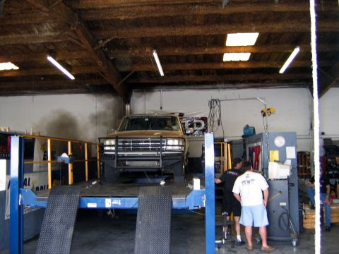 2000 Ford Crown Victoria - Ford F-Series truck undergoing testing on a dynamometer in a workshop.