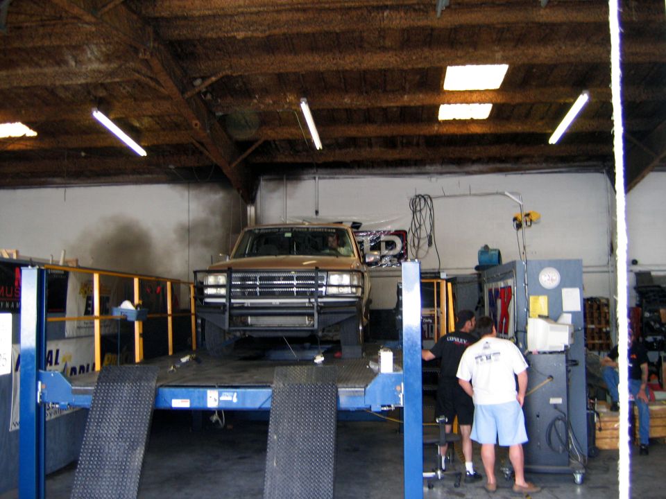 Ford F-Series truck on a dynamometer with a bull bar and aftermarket grille