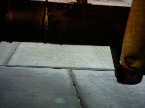 1990 Ford Bronco - A close-up view of the undercarriage of a vehicle, with a watermark for Supermotors.net visible.