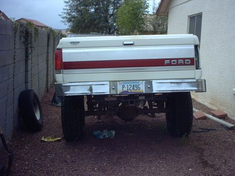 1990 Ford Bronco - Rear view of a 1990 Ford Bronco, showing the tailgate and license plate.