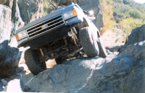 1990 Ford Bronco - This Ford Bronco is navigating a rocky off-road path.