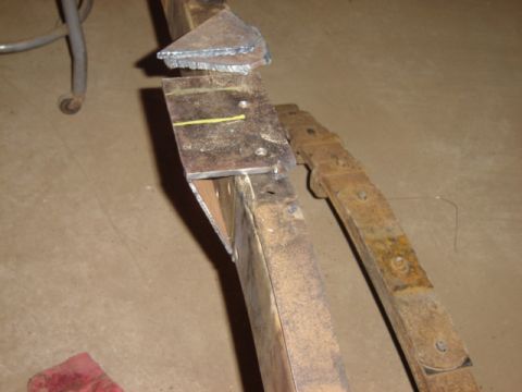 1992 Ford Bronco - Close-up of metal fabrication work on a vehicle's chassis components.
