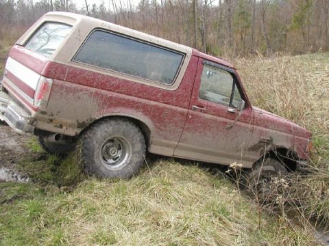 1988 Ford Bronco - Right front buried deep in the liquid mud.