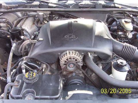 1999 Ford Crown Victoria - The engine bay of a vehicle is shown, with a date stamp indicating it was photographed on March 20, 2005.