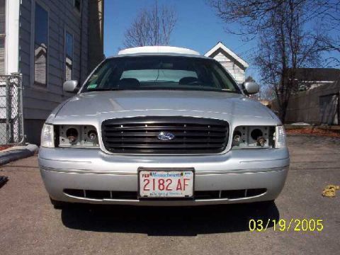 1999 Ford Crown Victoria - This 1999 Ford Crown Victoria is shown from the front, with both headlights removed.