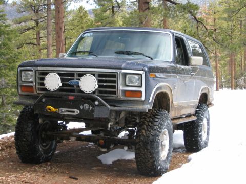 1985 Ford Bronco - This lifted Ford Bronco is equipped with auxiliary lights and a winch for off-road adventures.