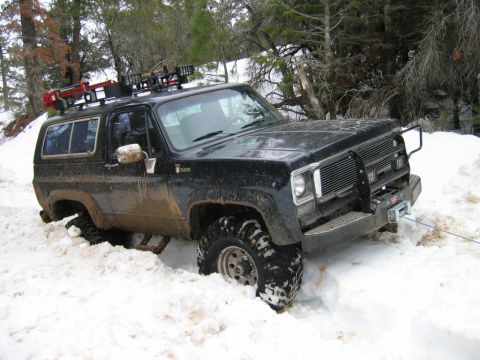 1985 Ford Bronco - This SUV appears to be a 1973 model, not a 1985 Ford Bronco, as it is stuck in deep snow.