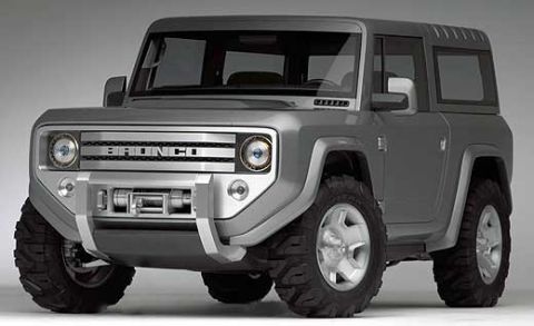 1995 Ford Bronco - This gray SUV features a prominent winch and a grille that reads 'BRONCO'.