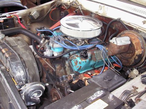 1979 Ford Bronco - Close-up view of a V8 engine bay, showing the air cleaner, distributor, and engine block.