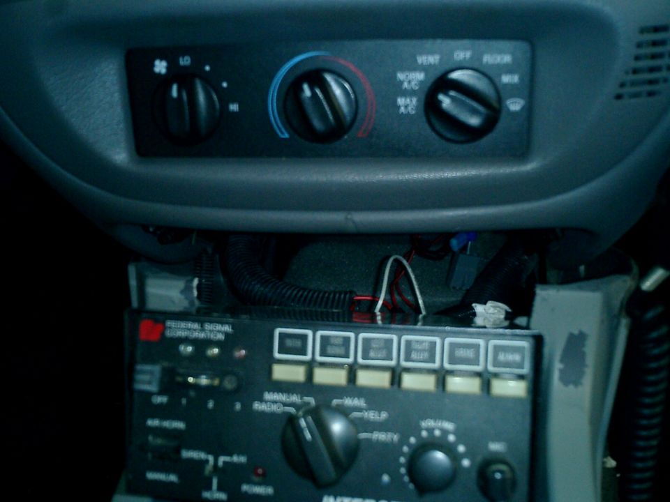 This one shows an upclose were the console meets the dash, the piece was trimmed so that I may install my siren/pa unit later my CB will be sitting on top of the siren to fill the hole a little more, also future plans call for a Marauder gauge pod to be installed.

If your wondering the Siren is a Federal Signal Pa400 which feature Siren/Pa/Airhorn and up to 9 light control functions