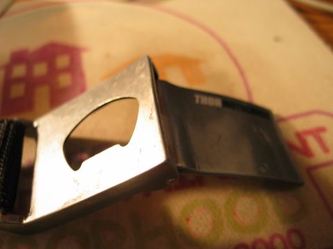 1995 Ford Bronco - This belt buckle features a built-in bottle opener and has the brand name THOR visible.