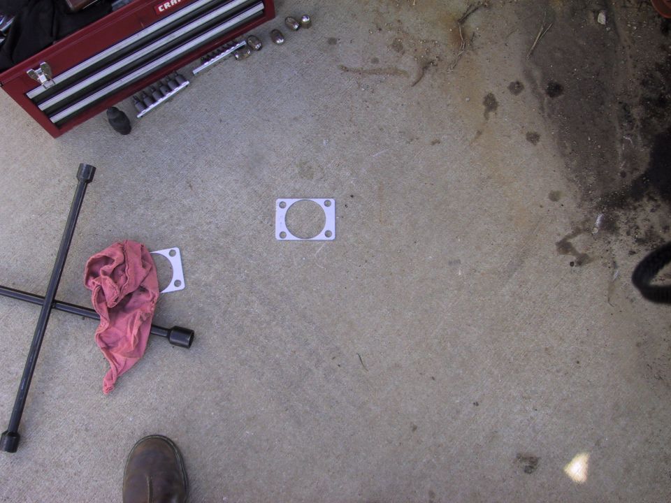 spacer to fill gap left by backing plate