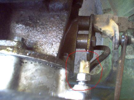 1988 Ford Bronco - A sensor is circled on the transfer case of a vehicle.