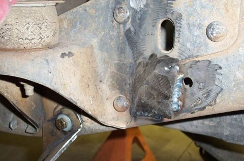 1986 Ford Ranger - The hanger would need to bolt on an uneven area of frame here, so I welded in some scrap and ground smooth