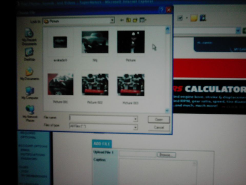Computer screen showing a file upload dialog with thumbnails of pictures, and a website called Supermotors.net in the background