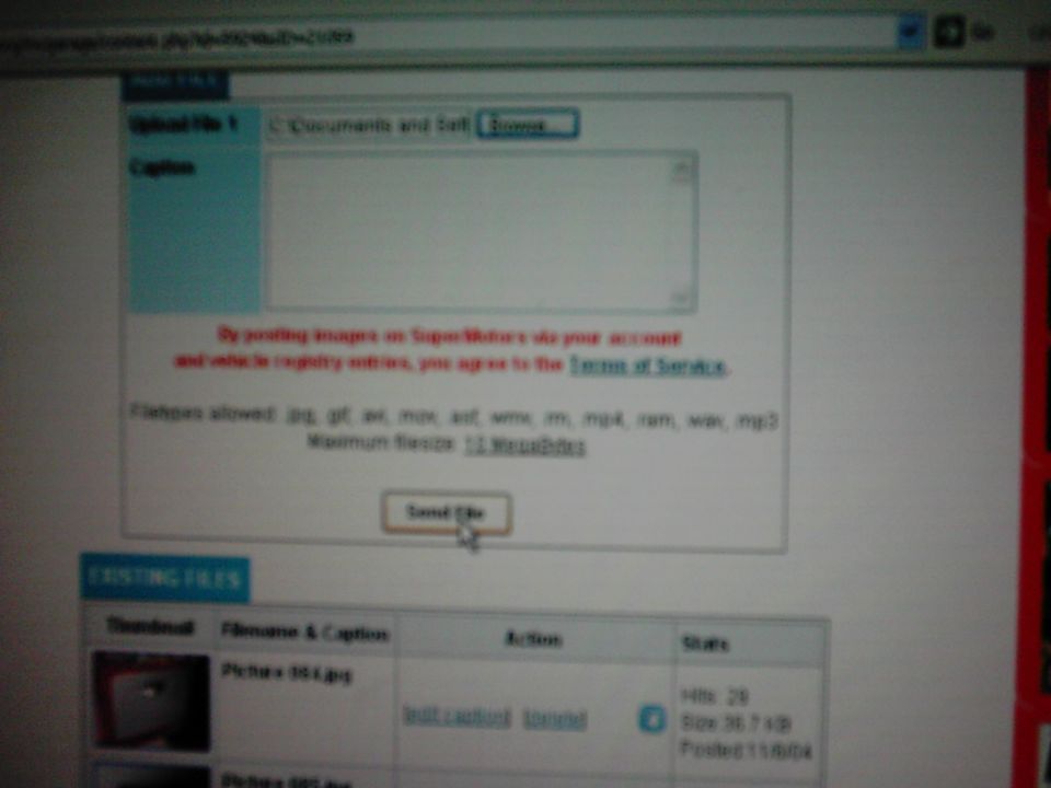 Computer screen displaying a file upload form with text about terms of service