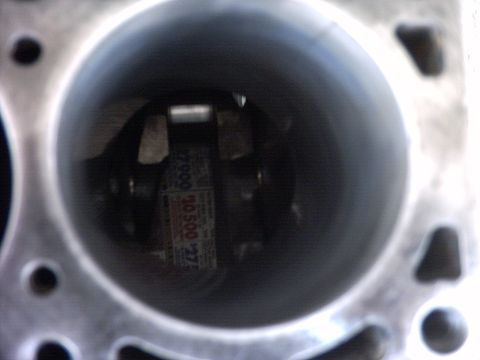 1989 Ford Probe - Close-up view inside an engine cylinder revealing internal components and a partial label.