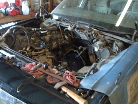 1989 Ford Crown Victoria LTD - Engine bay of a 1989 Ford Crown Victoria LTD during a repair.