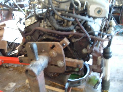 1989 Ford Crown Victoria LTD - The engine is mounted on a stand, ready for work or transport, with various hoses and components attached.