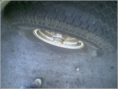 1993 Ford Bronco - A close-up view shows a tire and wheel, with the tread pattern visible.