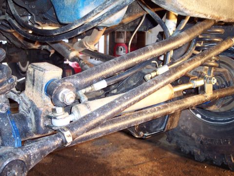 1974 Ford Bronco - Undercarriage view shows complex steering and suspension system components.