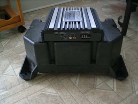 1993 Ford Taurus - A Kenwood amplifier is installed on a subwoofer enclosure, not a 1993 Ford Taurus.