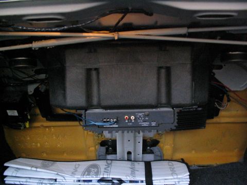 1993 Ford Taurus - Car trunk interior with aftermarket audio equipment installed.