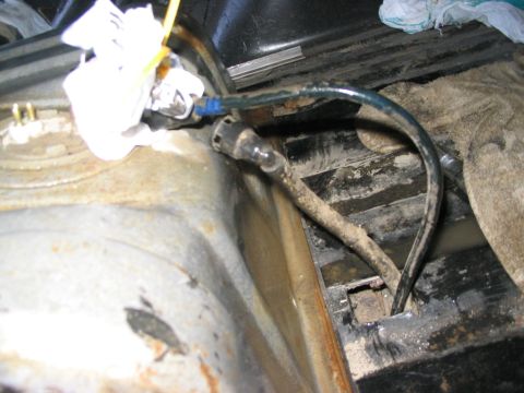 1986 Ford Bronco - Cut up through the cross member for the fuel lines .. there was a hole in it already on the bottom .. just had to cut out the top with the…