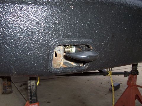 1994 Ford F-150 - Close-up view of a tow hook assembly on a vehicle's bumper.