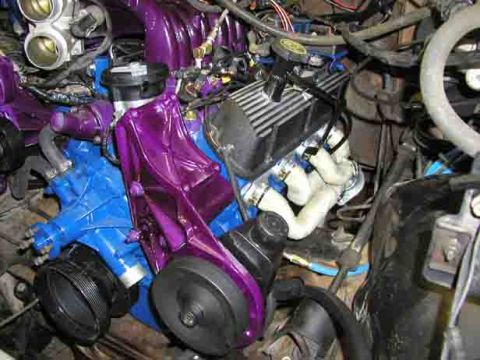1988 Ford Bronco - Custom painted engine components in a vehicle's engine bay, purple and blue accents.