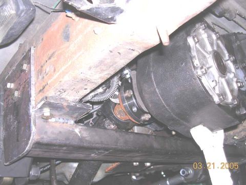 1994 Ford Bronco - Custom crossmember and transfer case assembly visible on the underbody of a vehicle.