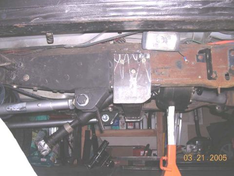1994 Ford Bronco - Close-up of custom underbody fabrication, showing a welded bracket and suspension parts. Date stamp: 03.21.2005.